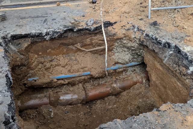 The crater, created by workers investigating ‘a dip in the road’ on Whittaker Lane in Prestwich, appears to be around six foot square and underground pipe-works can clearly be seen from the nearby pavement.