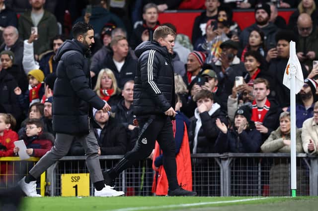 Manchester United's Portuguese head coach Ruben Amorim (L) and Newcastle United's English head coach Eddie Howe leave the pitch at half time during the English Premier League football match between Manchester United and Newcastle United at Old Trafford in Manchester, north west England, on December 30, 2024.