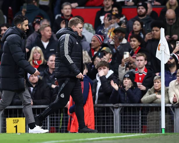 Manchester United's Portuguese head coach Ruben Amorim (L) and Newcastle United's English head coach Eddie Howe leave the pitch at half time during the English Premier League football match between Manchester United and Newcastle United at Old Trafford in Manchester, north west England, on December 30, 2024. 