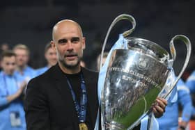 Manchester City's Spanish manager Pep Guardiola celebrates with the European Cup trophy after winning the UEFA Champions League final football match between Inter Milan and Manchester City at the Ataturk Olympic Stadium in Istanbul, on June 10, 2023. 