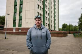 Megan Giglia outside her social housing flat in Pendlebury Towers, Stockport