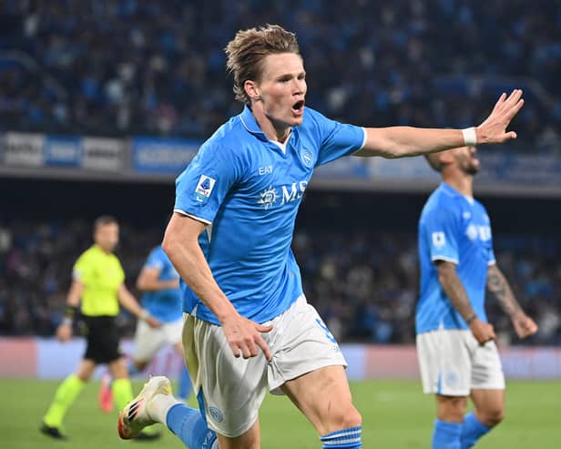 Scott McTominay celebrates scoring Napoli's first goal in the 2-0 win over Cagliari which clinched the Serie A title. (Photo by ISABELLA BONOTTO/AFP via Getty Images)          
