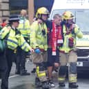 Police and emergency personnel dealing with a road traffic incident on Water Street near the Liver Building in Liverpool after a car collided with pedestrians during the Premier League winners' parade