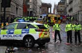 Police officers stand on duty at a cordon at the entrance to Water Street on May 26.