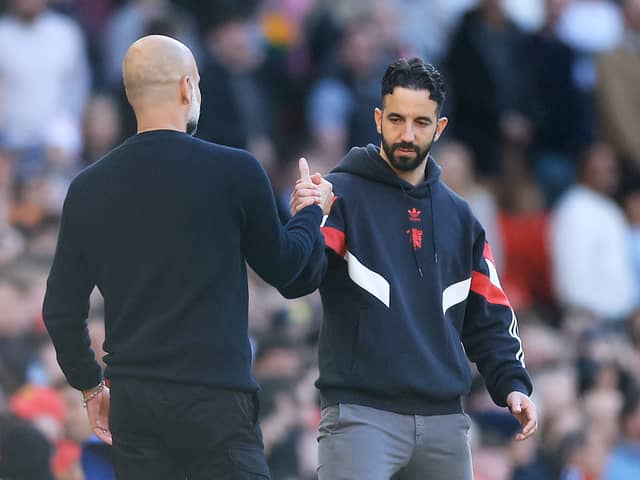 Ruben Amorim, Manager of Manchester United, embraces with Pep Guardiola, Manager of Manchester City, after the Premier League match between Manchester United FC and Manchester City FC at Old Trafford on April 06, 2025 in Manchester, England