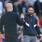 Ruben Amorim, Manager of Manchester United, embraces with Pep Guardiola, Manager of Manchester City, after the Premier League match between Manchester United FC and Manchester City FC at Old Trafford on April 06, 2025 in Manchester, England