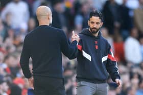 Ruben Amorim, Manager of Manchester United, embraces with Pep Guardiola, Manager of Manchester City, after the Premier League match between Manchester United FC and Manchester City FC at Old Trafford on April 06, 2025 in Manchester, England