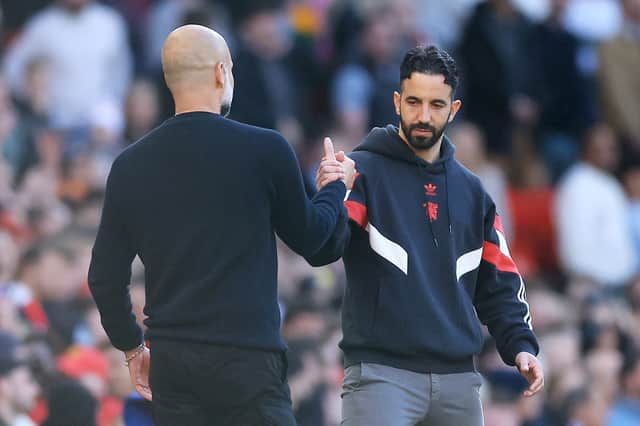 Ruben Amorim, Manager of Manchester United, embraces with Pep Guardiola, Manager of Manchester City, after the Premier League match between Manchester United FC and Manchester City FC at Old Trafford on April 06, 2025 in Manchester, England