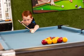 Teddie Tandy, six, says he 'plays pool in his dreams'.