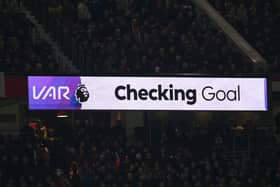 VAR Checking Goal sign is seen during the Premier League match between Manchester United FC and Newcastle United FC at Old Trafford on December 30, 2024 in Manchester, England.
