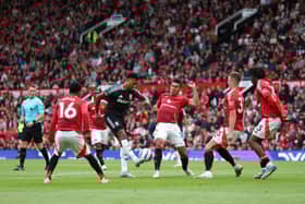 Ollie Watkins of Aston Villa shoots whilst surrounded by players of Manchester United during the Premier League match between Manchester United FC and Aston Villa FC at Old Trafford on May 25, 2025 in Manchester, England.