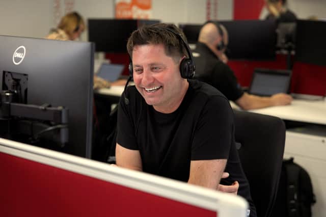 George Clarke answering calls at Mitsubishi Electric