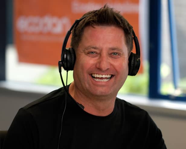 George Clarke answering calls at Mitsubishi Electric 
