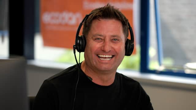 George Clarke answering calls at Mitsubishi Electric