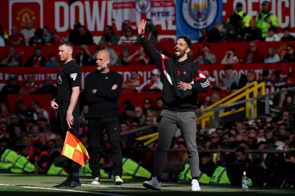 Ruben Amorim, Manager of Manchester United, gestures as Pep Guardiola, Manager of Manchester City, looks on during the Premier League match between Manchester United FC and Manchester City FC at Old Trafford on April 06, 2025 in Manchester, England. 