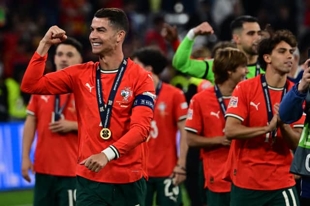 Portugal's players including Portugal's forward #07 Cristiano Ronaldo celebrate after winning the UEFA Nations League final football match between Portugal and Spain in Munich, southern Germany on June 8, 2025.
