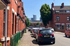 Between the red-brick terraces of Ordsall, Manchester’s glimmering towers come into view