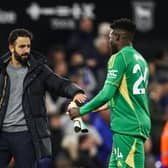 Manchester United's Portuguese head coach Ruben Amorim (L) shakes hands with Manchester United's Cameroonian goalkeeper #24 Andre Onana (R) at the end of the English Premier League football match between Ipswich Town and Manchester United at Portman Road in Ipswich, eastern England on November 24, 2024.
