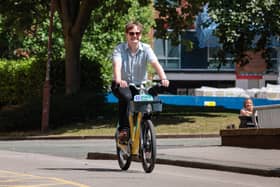 Local democracy reporter on a Bee Network electric bike in Manchester