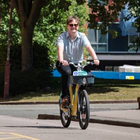 Local democracy reporter on a Bee Network electric bike in Manchester