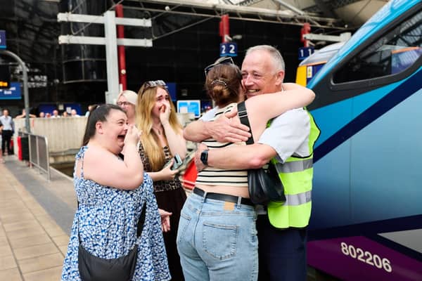 Ian being greeted by his family