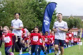 Three-time Olympic and World Champion Max Whitlock and Team GB long jumper Abigail Irozuru visited a primary school in Salford in celebration of Olympic Day.