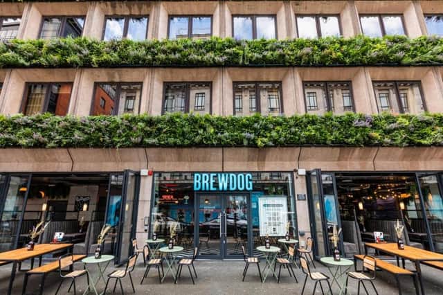 BrewDog DogHouse Manchester stands out with its leafy facade, buzzing outdoor tables and quirky vibe right in the heart of the city