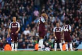 Marcus Rashford of Aston Villa looks dejected after his side concedes the first goal scored by Bernardo Silva of Manchester City during the Premier League match between Manchester City FC and Aston Villa FC at Etihad Stadium on April 22, 2025 in Manchester, England. 