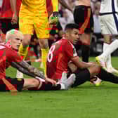 Manchester United's Argentinian forward #17 Alejandro Garnacho and Manchester United's Brazilian midfielder #18 Casemiro react at the end of the UEFA Europa League final football match between Tottenham Hotspur and Manchester United at San Mames stadium in Bilbao on May 21, 2025. 