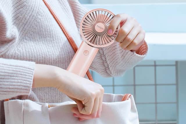 It's compact enough to slip in a bag - and you can even wear it around your neck