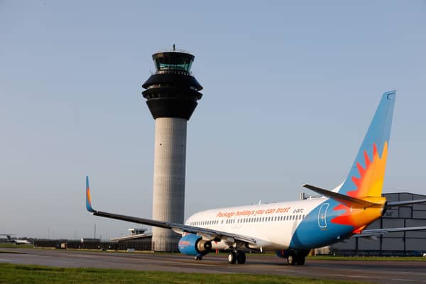 Manchester Airport ATC tower with Jet2 aircraft