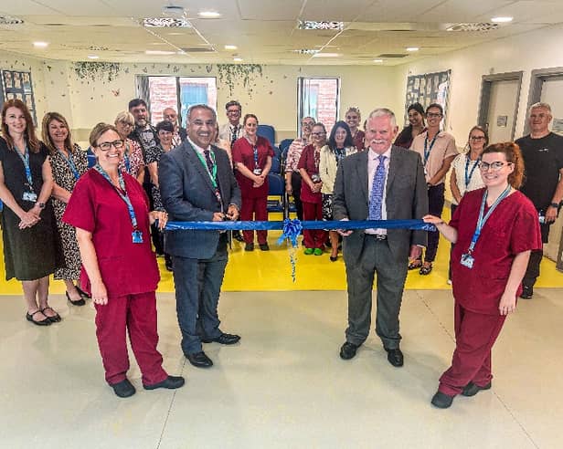 Nikhil Khashu (CEO) and Martyn Taylor (Chair) officially open the dental clinic with colleagues and partners