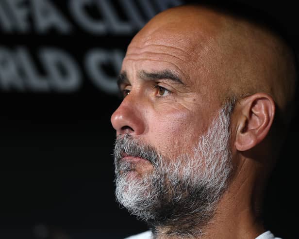 Manchester City manager Pep Guardiola looks on in frustration.