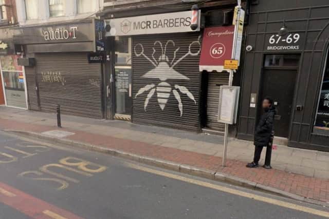Bar 11, in between a hi-fi shop and barbers, on Bridge Street in Manchester City Centre