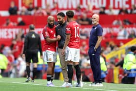 Bryan Mbeumo and Matheus Cunha of Manchester United interact with Ruben Amorim, Manager of Manchester United during the pre-season friendly match between Manchester United and ACF Fiorentina at Old Trafford on August 09, 2025 in Manchester, England. 