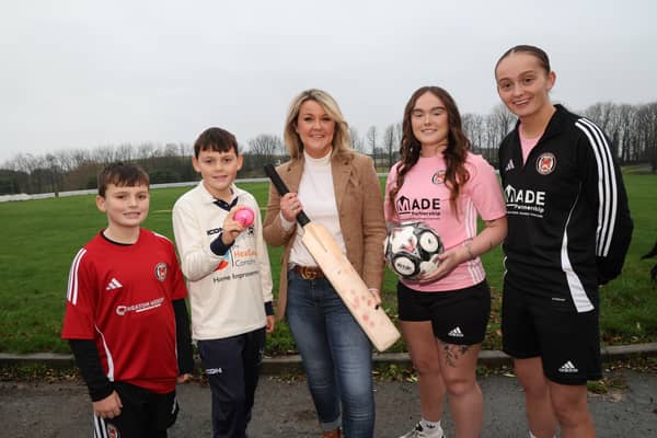 (l-r) Bobby Mackenzie with brother Teddy, a member of the junior team at Hyde Cricket Club, with Kate McClean, head of planning at MADE Partnership, and Denika Connolly and Maisie Malone of Hyde United FC’s women’s team.