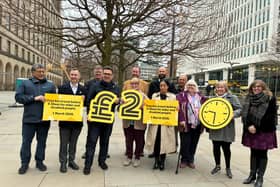 Andy Burnham, holding the pound sign, announces Bee Network bus fares will be frozen in 2026 and the 9.30am disabled/old people's bus pass rule will be scrapped in March