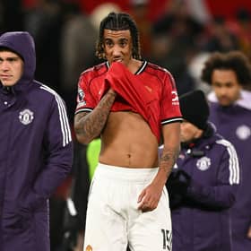 Manchester United's Uruguayan midfielder #25 Manuel Ugarte (L) and Manchester United's French defender #15 Leny Yoro (R) react at the end of the English Premier League football match between Manchester United and Wolverhampton Wanderers at Old Trafford in Manchester, north west England, on December 30, 2025.