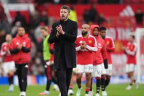 Michael Carrick applauds the fans after his side’s 3-0 home defeat to Bournemouth 