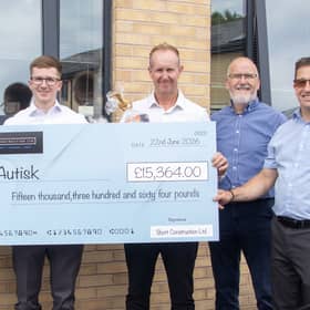 Short Construction handing over their fundraising cheque to Jan Bennett, CEO of Stockport charity, Autisk.