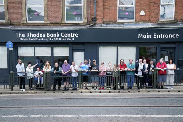 Pennine Mencap team and service users outside premises on union street