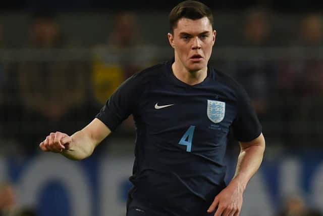 England ́s Michael Keane plays the ball during a friendly football match between Germany and England on March 22, 2017 in Dortmund, western Germany. 
It is Lukas Podolski's last match with the German team. / AFP PHOTO / PATRIK STOLLARZ        (Photo credit should read PATRIK STOLLARZ/AFP via Getty Images)