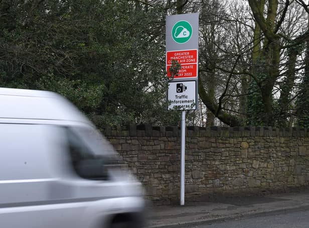 <p>Signs warning of the new Greater Manchester Clean Air Zone (image: Neil Cross)</p>