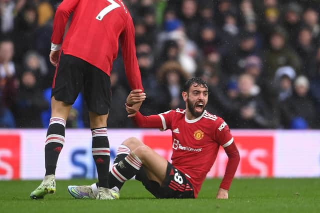 Bruno Fernandes protests Adam Forshaw's challenge. Pic: Laurence Griffiths.