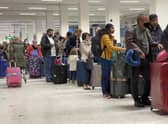 Passengers queue for check-in at Manchester Airport's terminal 1 on April 5. Photo by Christopher Furlong/Getty Images.