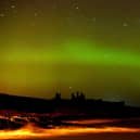 The aurora borealis, or the northern lights as they are commonly known at Dunstanburgh Castle in Northumberland. PRESS ASSOCIATION Photo. Picture date: Tuesday February 17, 2015. See PA story ENVIRONMENT Aurora. Photo credit should read: Owen Humphreys/PA Wire
