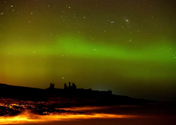 The aurora borealis, or the northern lights as they are commonly known at Dunstanburgh Castle in Northumberland. PRESS ASSOCIATION Photo. Picture date: Tuesday February 17, 2015. See PA story ENVIRONMENT Aurora. Photo credit should read: Owen Humphreys/PA Wire