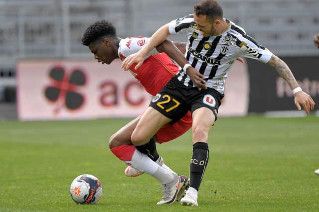 Angers' French-Portuguese midfielder Mathias Pereira Lage fights for the ball with Monaco's French midfielder Aurelien Tchouameni during the French L1 football match between Angers (SCO) and Monaco (AS) at the Raymond Kopa Stadium in Angers, western France, on April 25, 2021. (Photo by LOIC VENANCE / AFP) (Photo by LOIC VENANCE/AFP via Getty Images)
