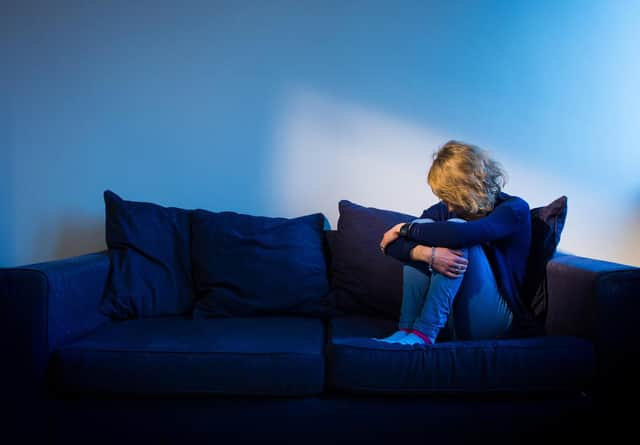 PICTURE POSED BY A MODEL Undated photo of a woman sitting on a sofa. Three specialist rape courts are to be set up in England as part of a pilot scheme designed to improve dismal conviction rates for serious sexual offences. Issue date: Thursday June 16, 2022.