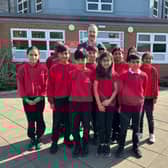 Ewan McPherson, Interim Executive Principal at Lyndhurst Primary and Nursery School with pupils from the school